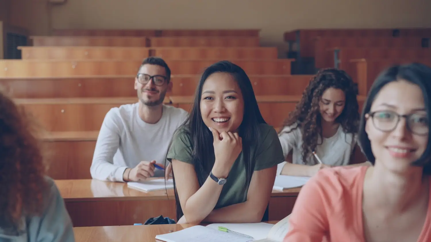 A native English teacher engaging students in a bright classroom in Korea