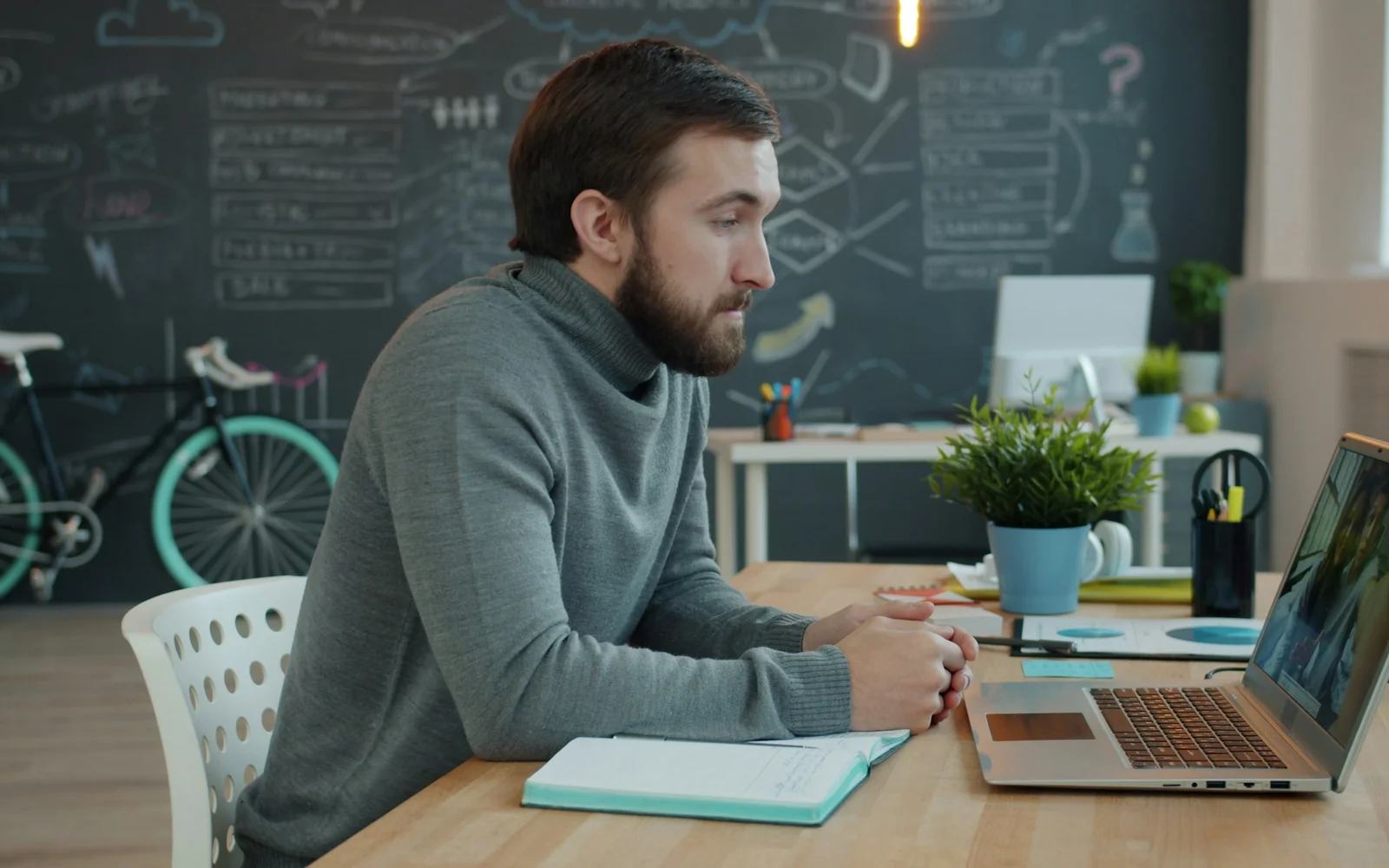 Candidate on a video call at a laptop — preparing for an EPIK interview